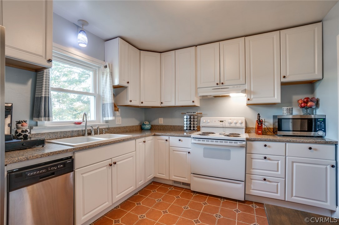 8445 Stumpy Road Hanover, VA 23069 - Photo 8 of 49 a kitchen with cabinets appliances a sink and a window