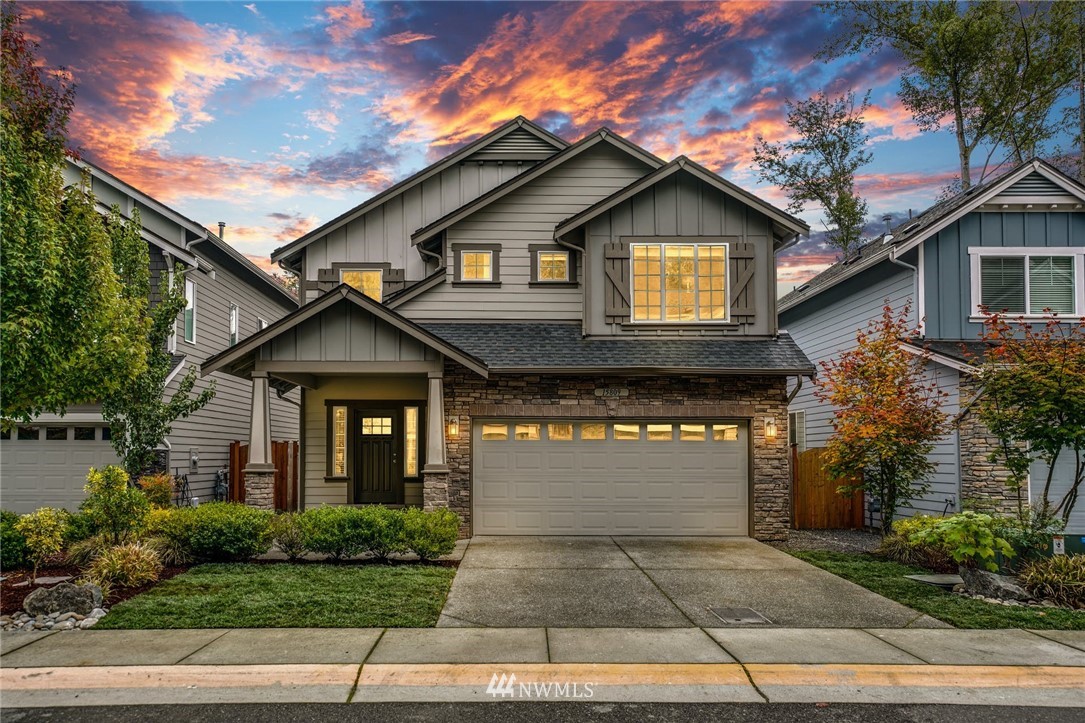 15809 Meridian Avenue South Bothell, WA 98012 - Photo 1 of 32 a front view of a house with yard