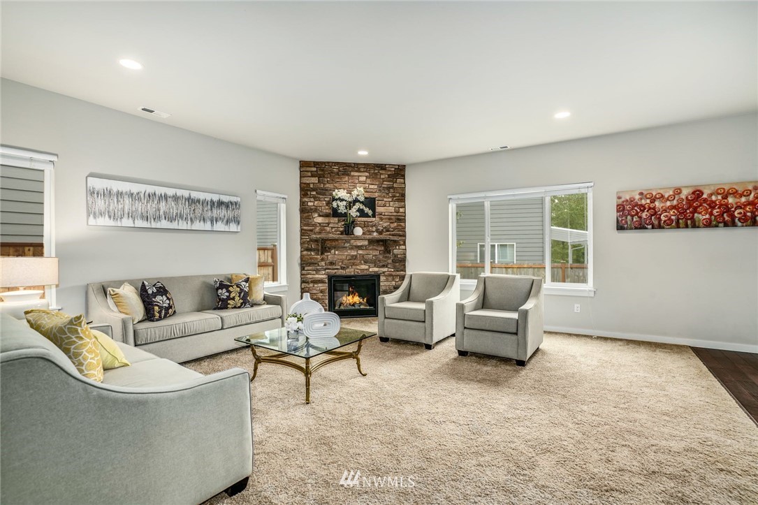 15809 Meridian Avenue South Bothell, WA 98012 - Photo 4 of 32 a living room with furniture and a large window