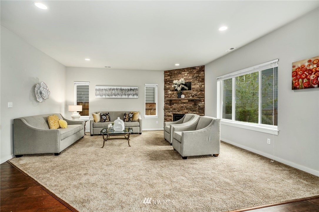 15809 Meridian Avenue South Bothell, WA 98012 - Photo 5 of 32 a living room with furniture and a large window