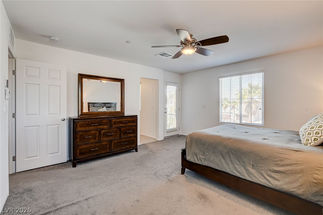 484 Filaree Place Henderson, NV 89015 - Photo 46 of 71 This spacious bedroom offers comfortable living and a private balcony for relaxation.