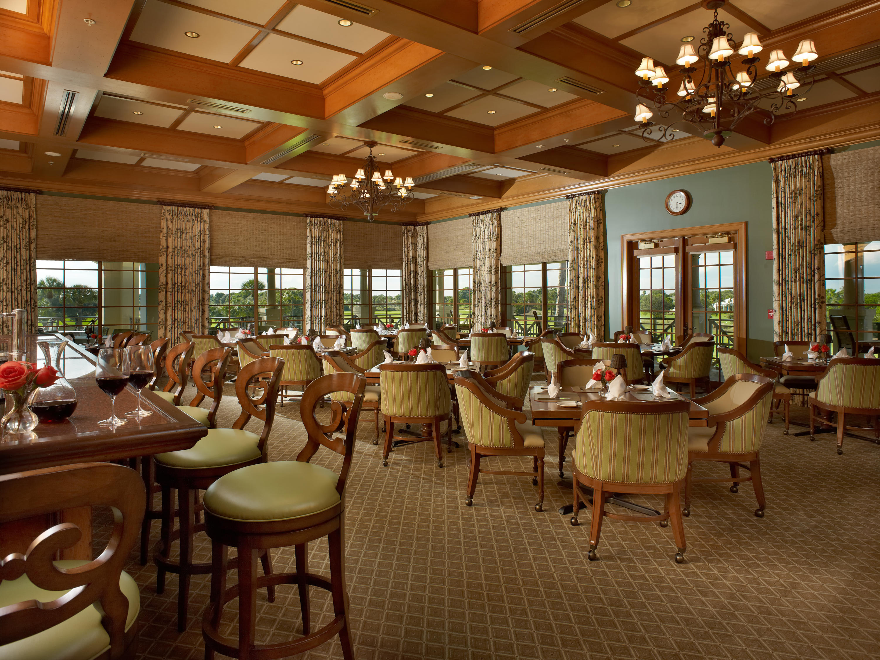 108 Micco Circle Jupiter, FL 33458 - Photo 14 of 20 a room with lots of tables a large window and chairs