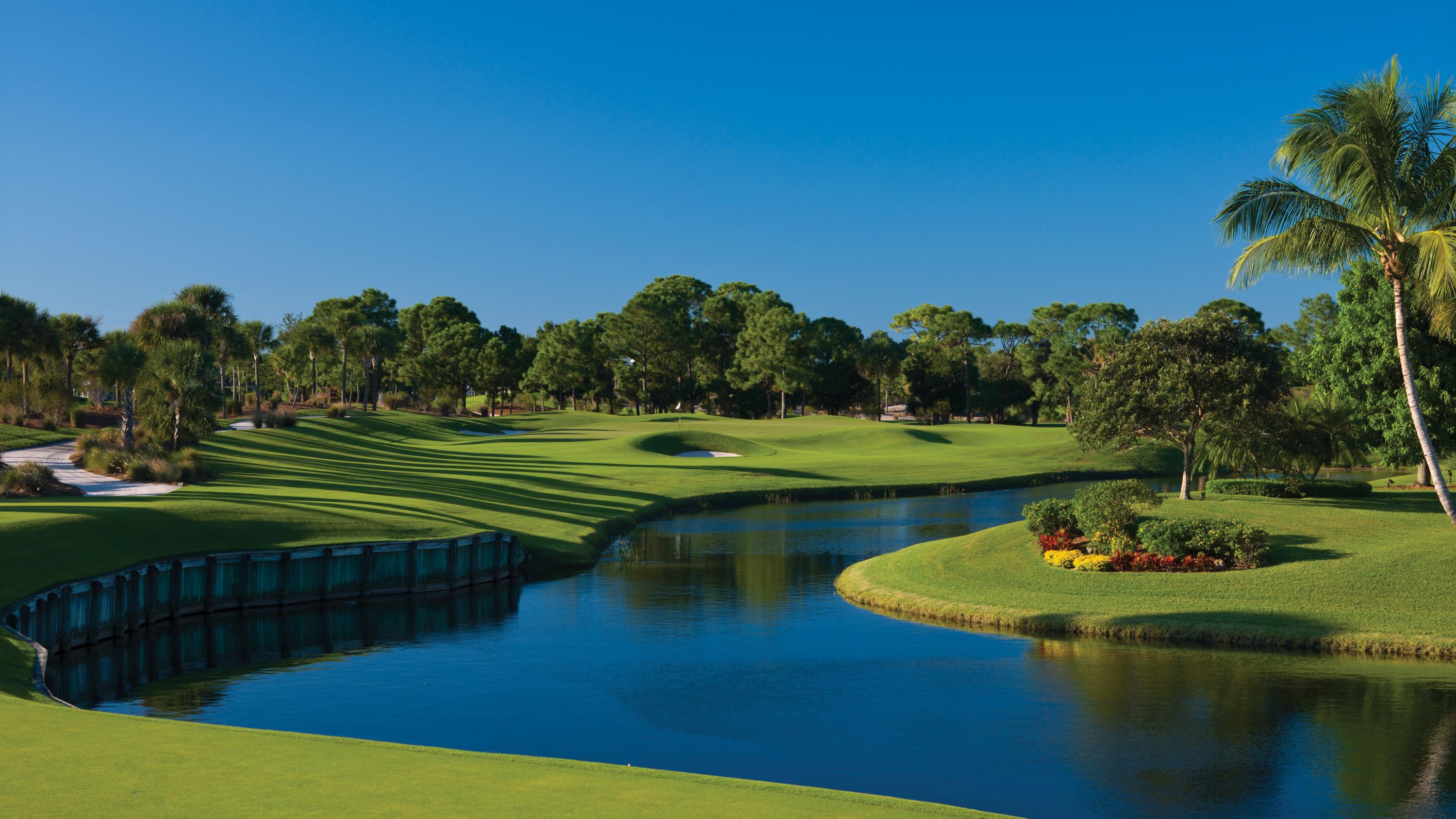 108 Micco Circle Jupiter, FL 33458 - Photo 9 of 20 a view of a golf course with a lake view