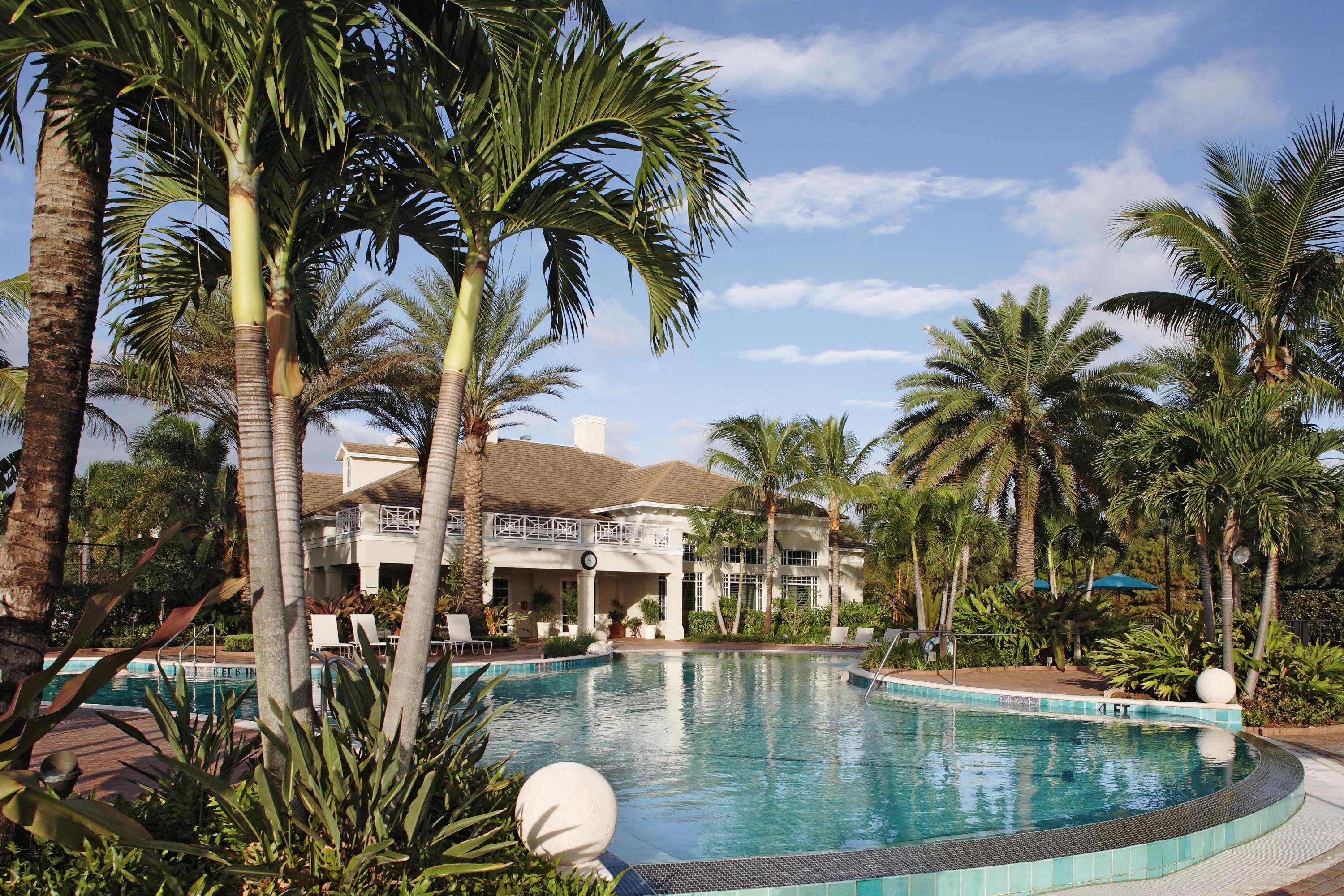 108 Micco Circle Jupiter, FL 33458 - Photo 10 of 20 a view of swimming pool with outdoor seating and plants