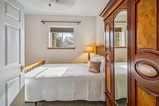 a bedroom with a bed and a fireplace