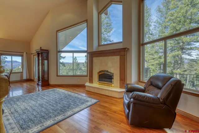 a view of a balcony with wooden floor and outdoor space