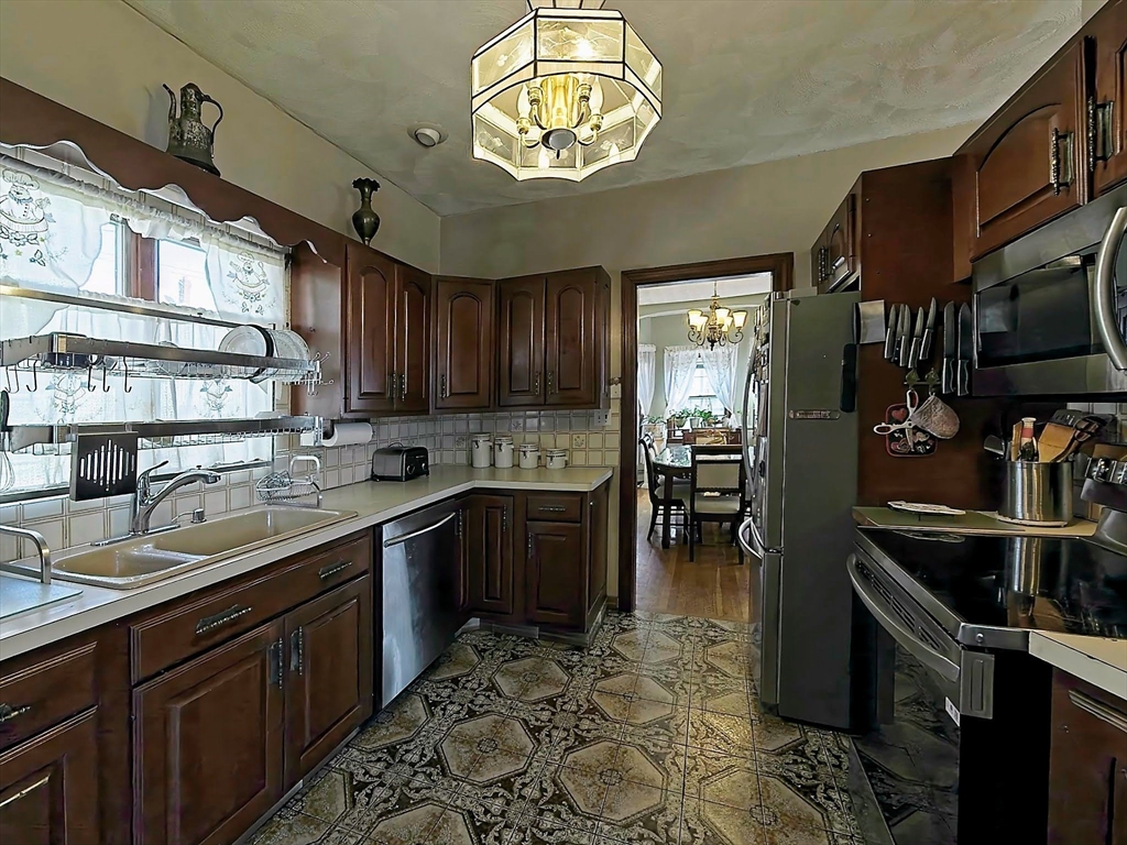 20 Locust Street Everett, MA 02149 - Photo 12 of 39 a kitchen with lots of counter top space and appliances