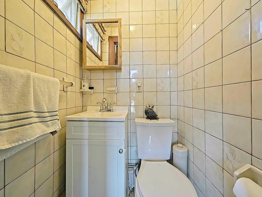 20 Locust Street Everett, MA 02149 - Photo 15 of 39 a bathroom with a toilet sink and shower