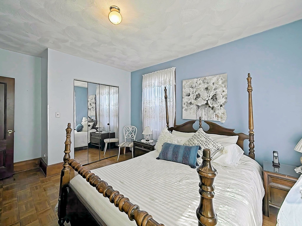 20 Locust Street Everett, MA 02149 - Photo 18 of 39 a view of a dining room with furniture and wooden floor