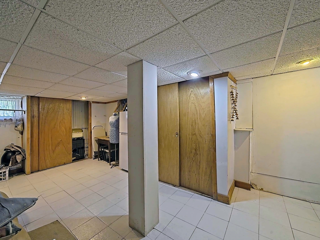 20 Locust Street Everett, MA 02149 - Photo 27 of 39 a view of a hallway with closet and a bathroom