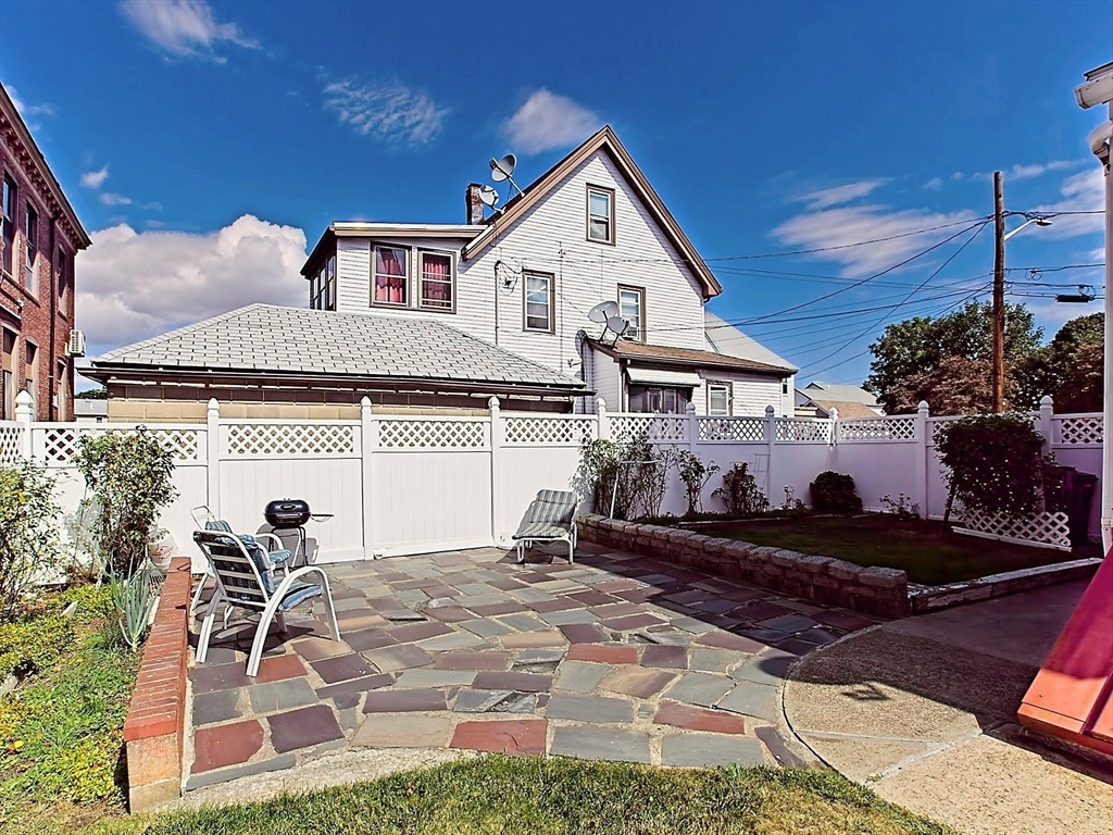 20 Locust Street Everett, MA 02149 - Photo 30 of 39 a front view of a house with a yard