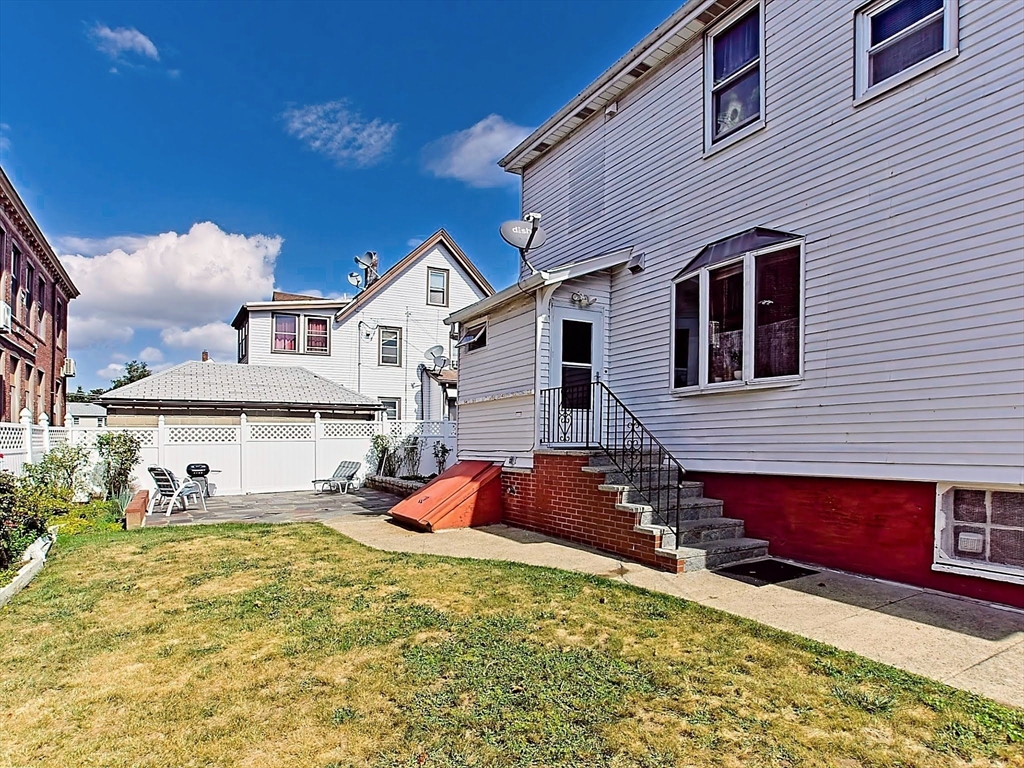 20 Locust Street Everett, MA 02149 - Photo 31 of 39 a view of a house with a patio