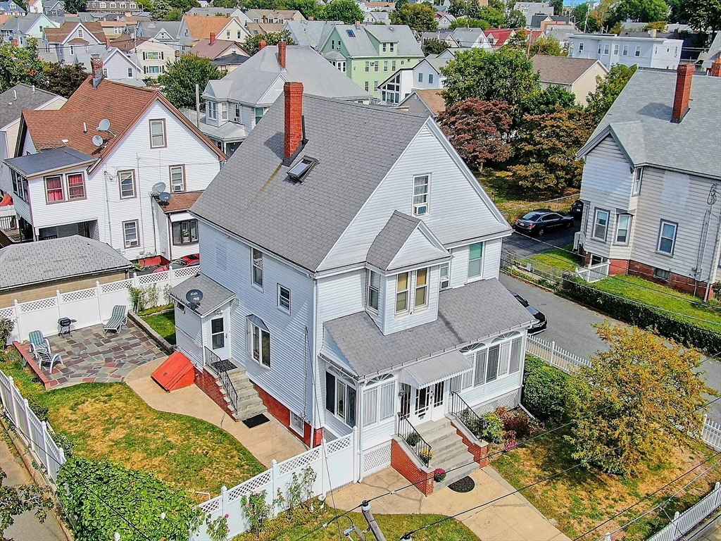 20 Locust Street Everett, MA 02149 - Photo 33 of 39 an aerial view of residential houses with outdoor space