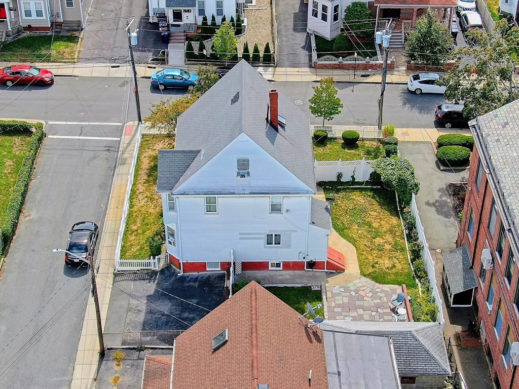 20 Locust Street Everett, MA 02149 - Photo 34 of 39 an aerial view of residential houses with outdoor space