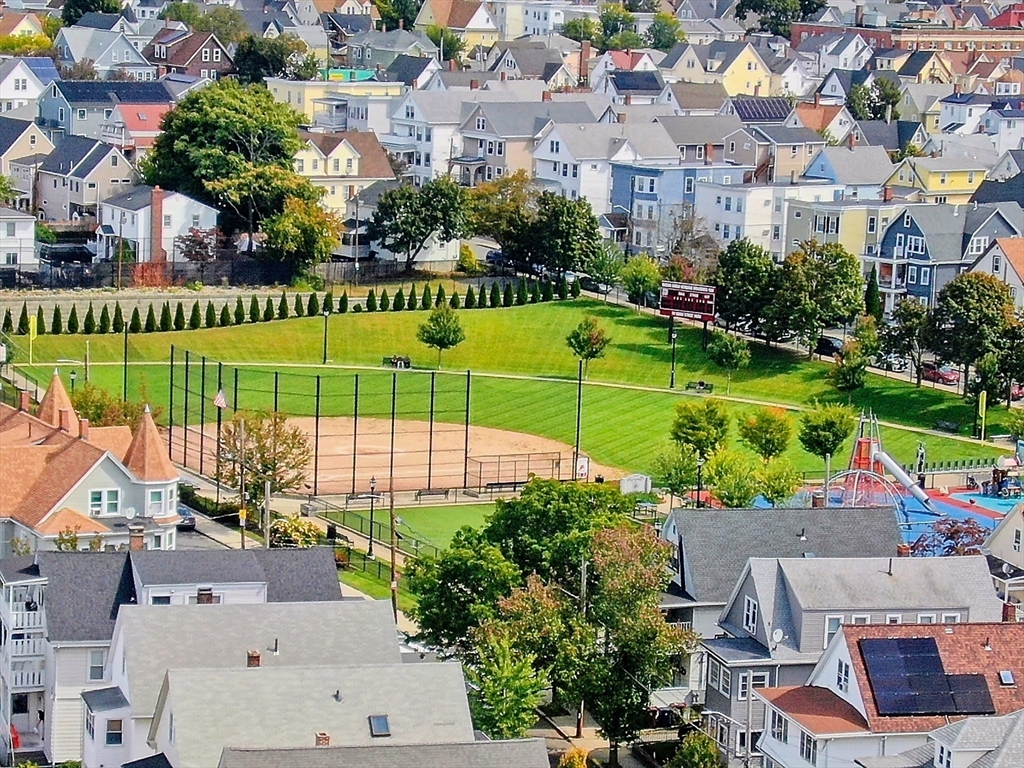 20 Locust Street Everett, MA 02149 - Photo 36 of 39 an aerial view of a house with a garden and lake view