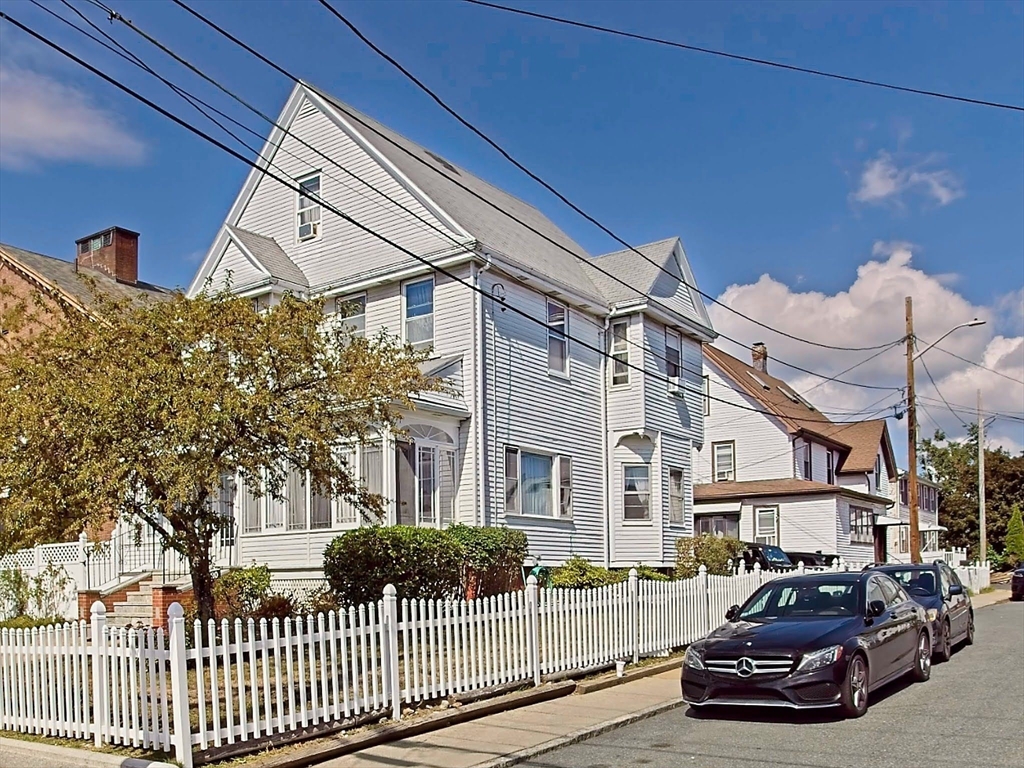 20 Locust Street Everett, MA 02149 - Photo 38 of 39 a front view of a house with a garden