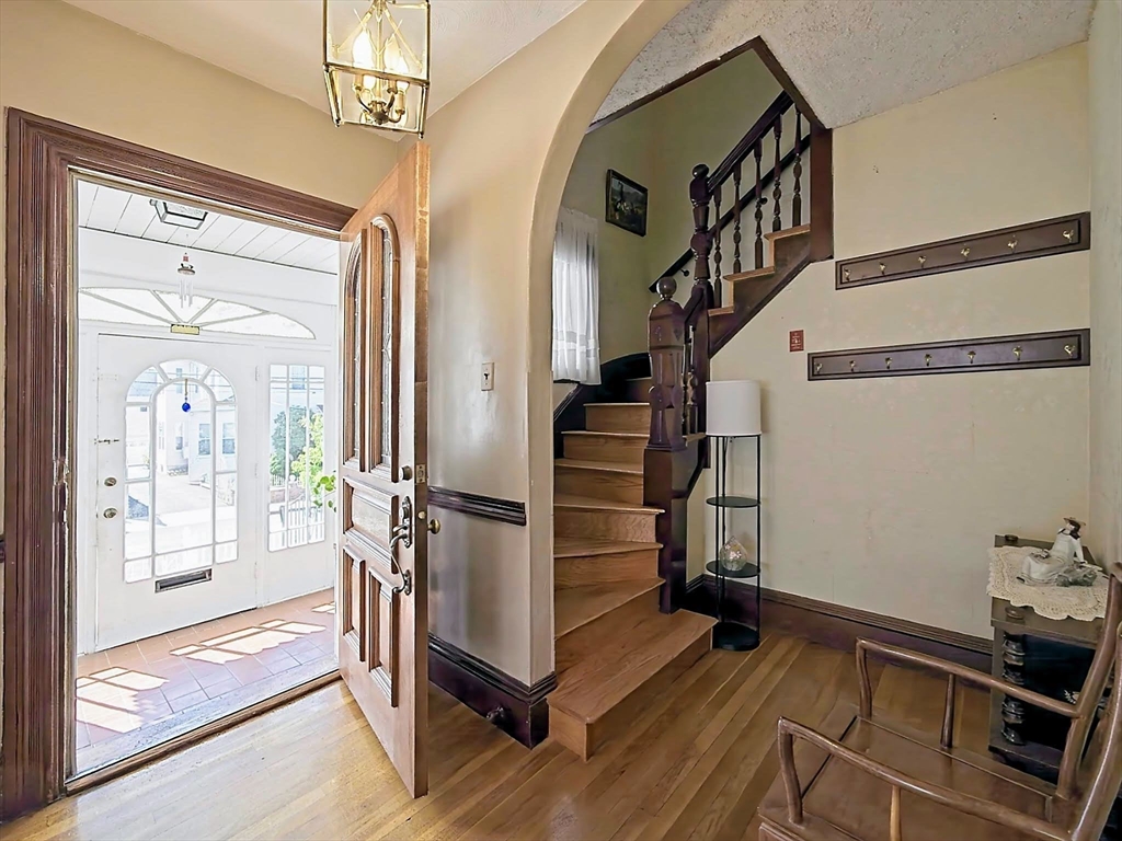 20 Locust Street Everett, MA 02149 - Photo 5 of 39 a view of entryway and hall with wooden floor
