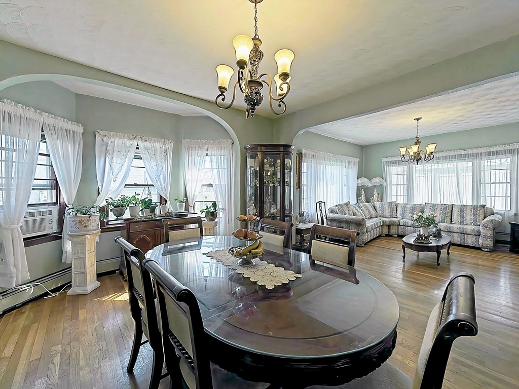 20 Locust Street Everett, MA 02149 - Photo 7 of 39 a view of a dining room with furniture and wooden floor