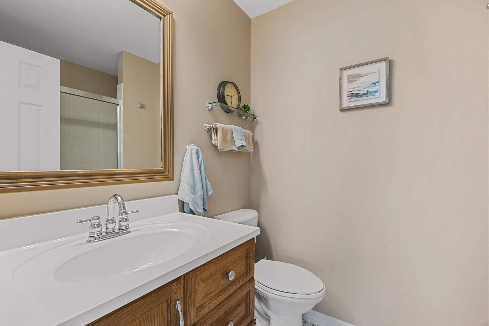 27-w710 Windermere Road, Unit 3201 Winfield, IL 60190 - Photo 12 of 20 a bathroom with a granite countertop sink mirror a toilet and a mirror