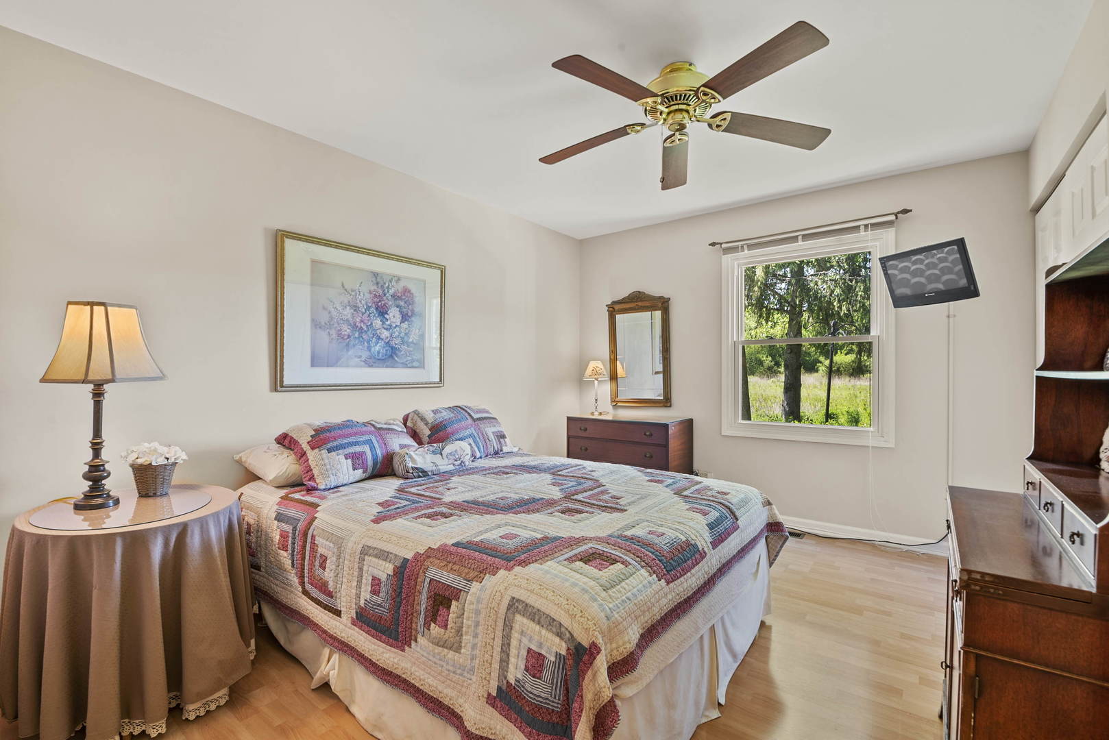 27-w710 Windermere Road, Unit 3201 Winfield, IL 60190 - Photo 14 of 20 a bedroom with a bed and a flat screen tv