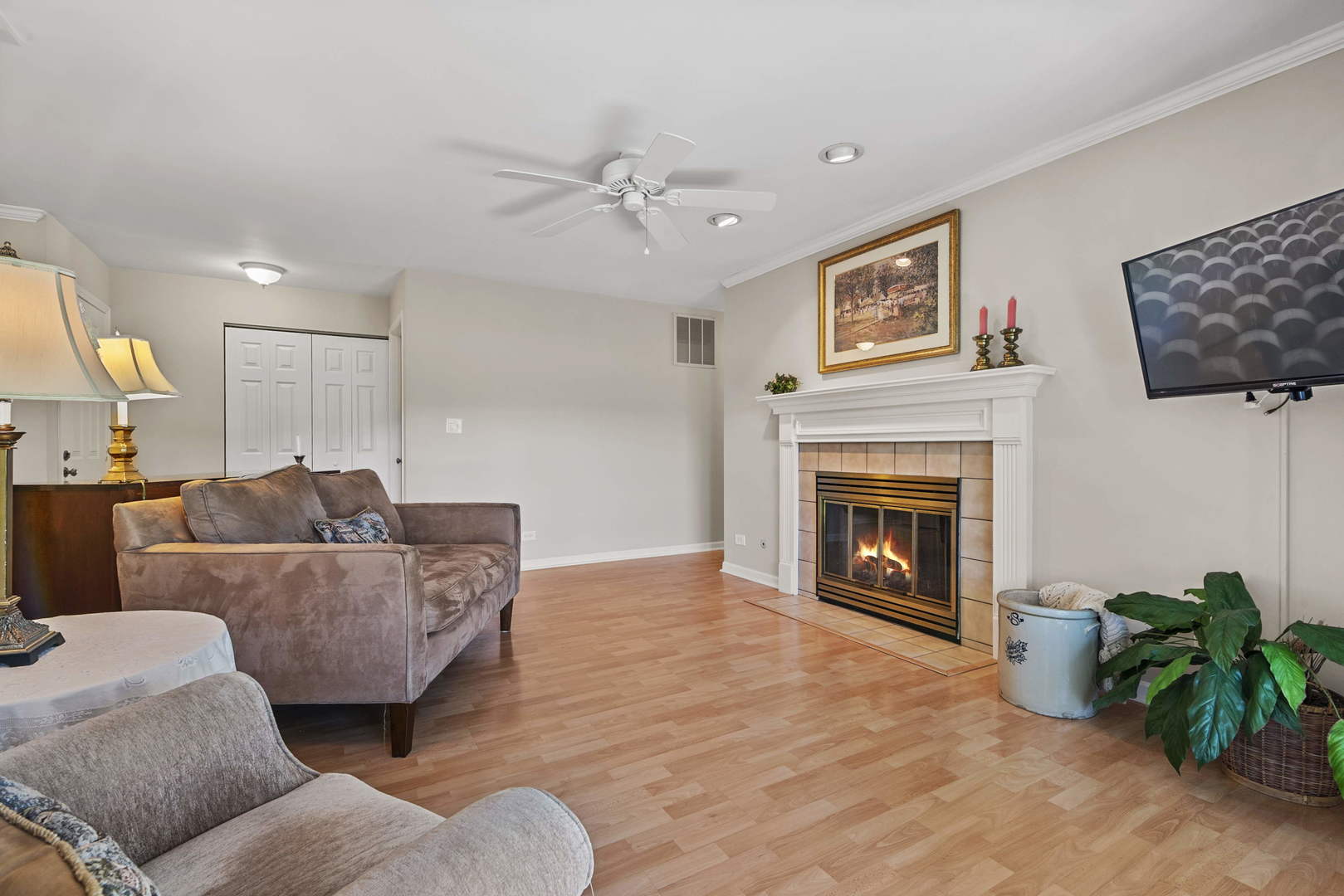 27-w710 Windermere Road, Unit 3201 Winfield, IL 60190 - Photo 4 of 20 a living room with furniture and a fireplace