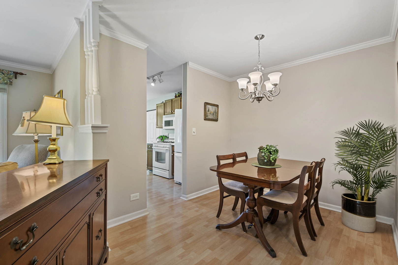 27-w710 Windermere Road, Unit 3201 Winfield, IL 60190 - Photo 7 of 20 a view of a dining room with furniture and chandelier