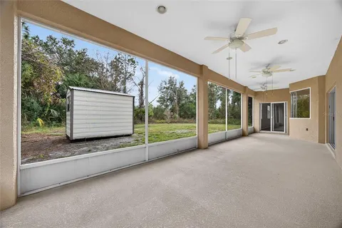 a view of room with window and ceiling fan