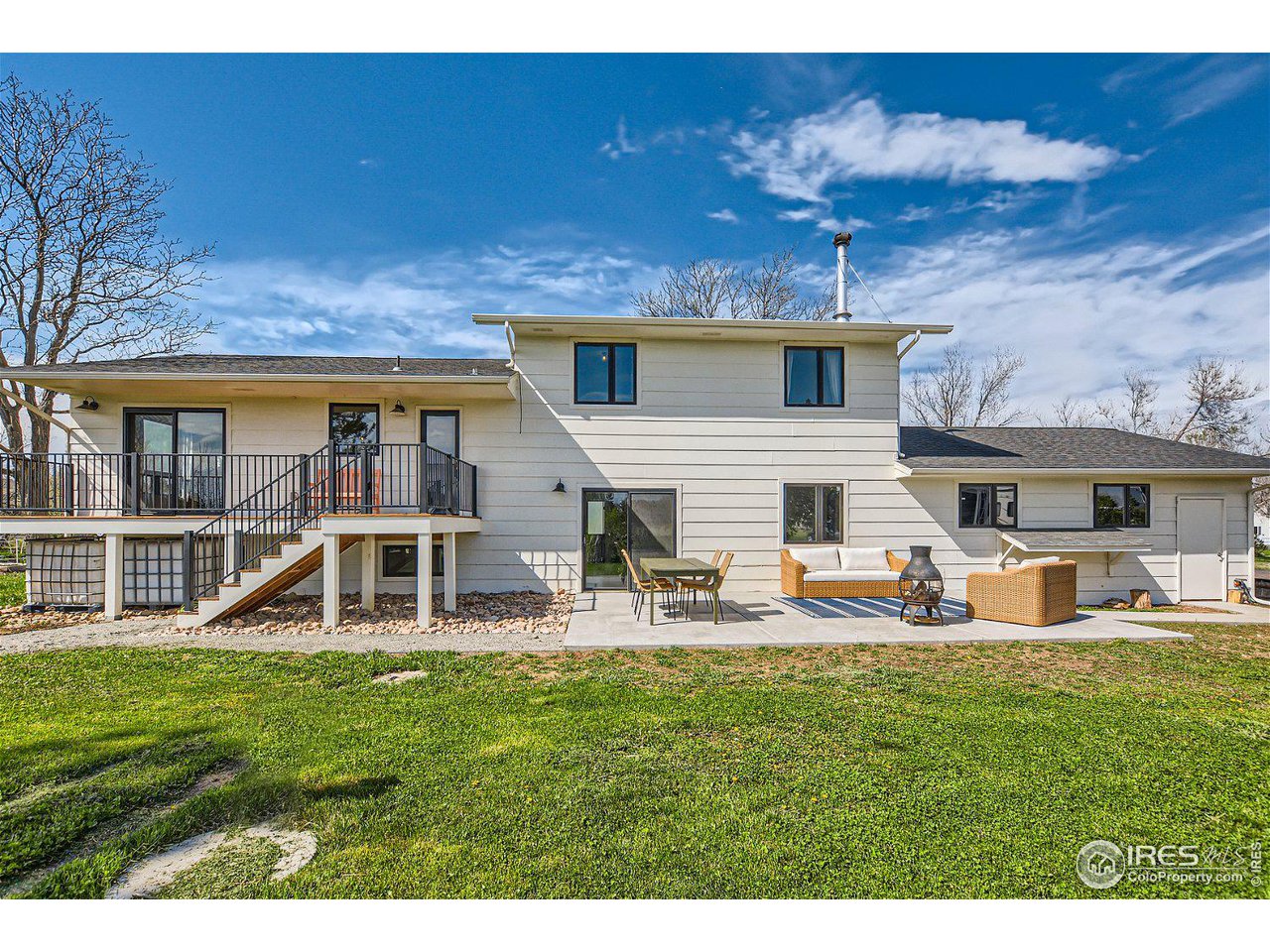 6474 Redwing Place Longmont, CO 80503 - Photo 11 of 11 a view of a house with a yard porch and sitting area