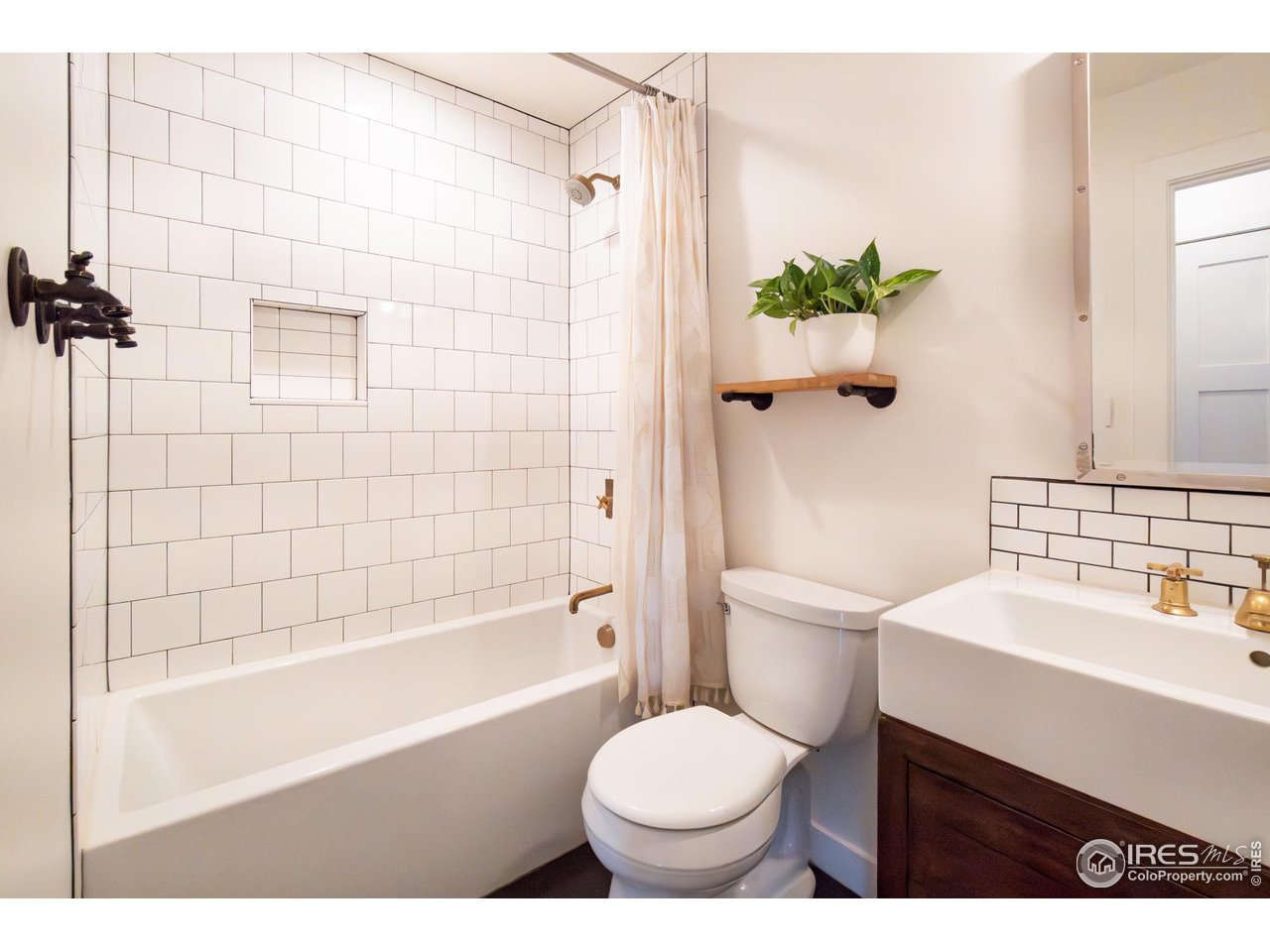 6474 Redwing Place Longmont, CO 80503 - Photo 7 of 11 a bathroom with a sink toilet and shower