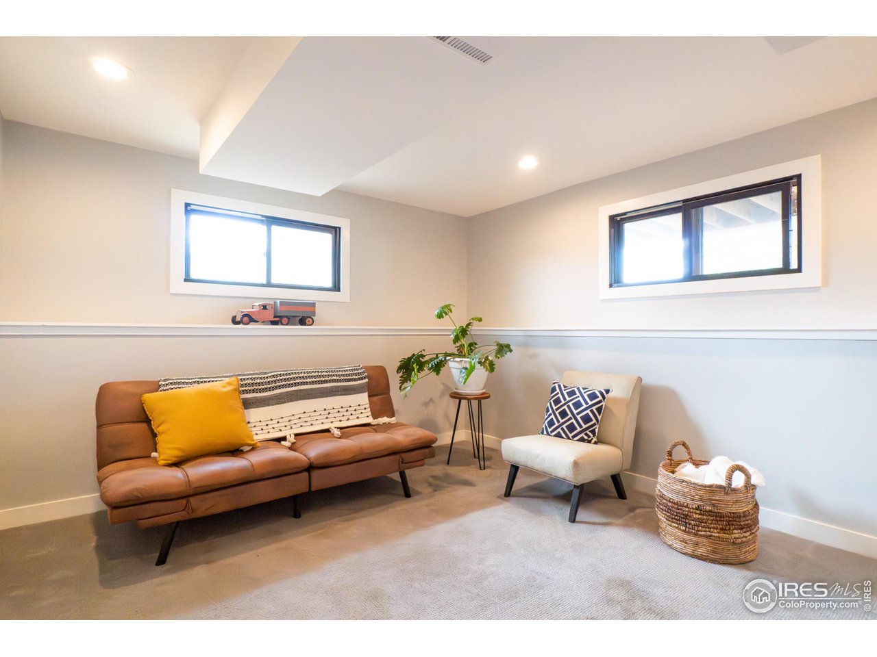 6474 Redwing Place Longmont, CO 80503 - Photo 8 of 11 a living room with furniture and a couch