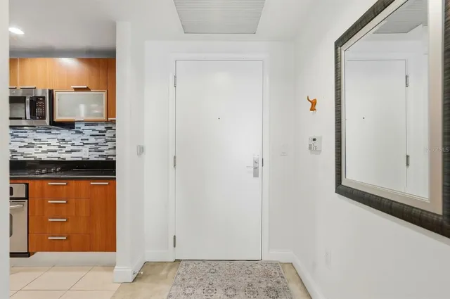 a kitchen with stainless steel appliances granite countertop a stove and a refrigerator