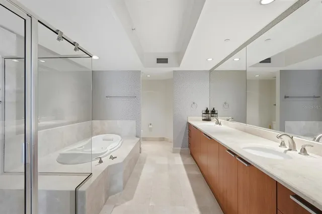 a bathroom with a shower and a sink