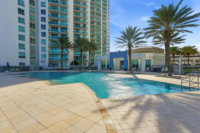 a view of a swimming pool and an outdoor space