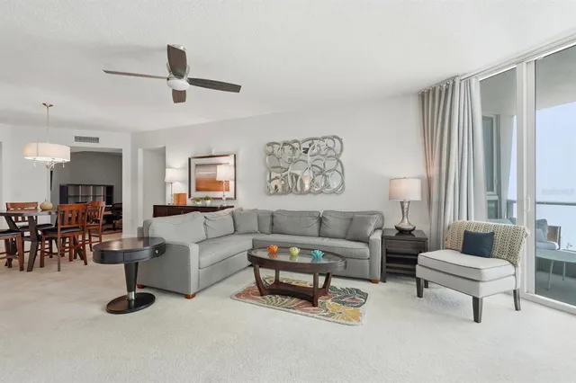 a living room with furniture and a table