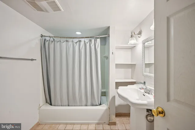 a backyard of a house with outdoor seating