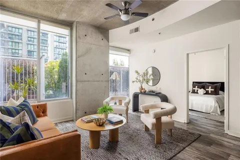 a living room with furniture and a window