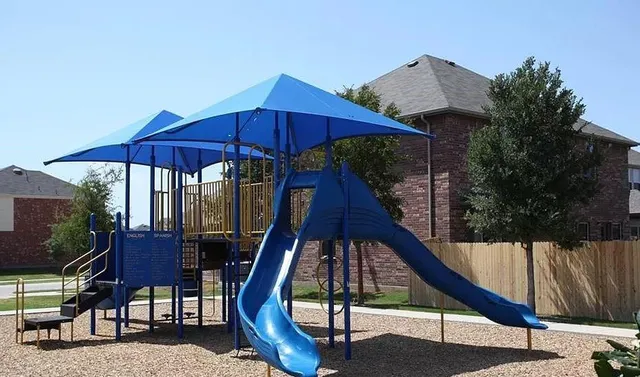 a sitting area with furniture and umbrella