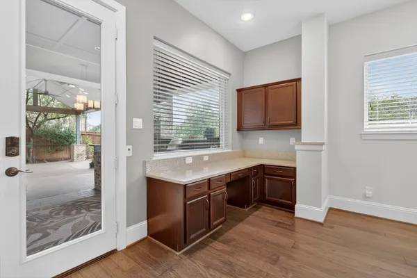 a view of a kitchen with a sink and a large window