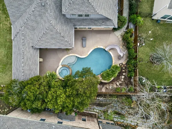 an aerial view of a house with outdoor space