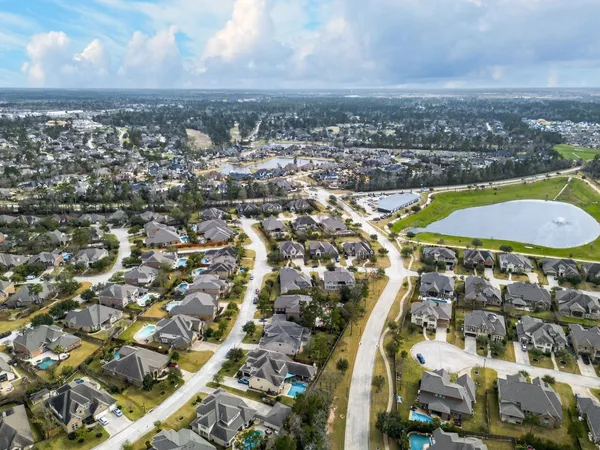 an aerial view of a house with outdoor space