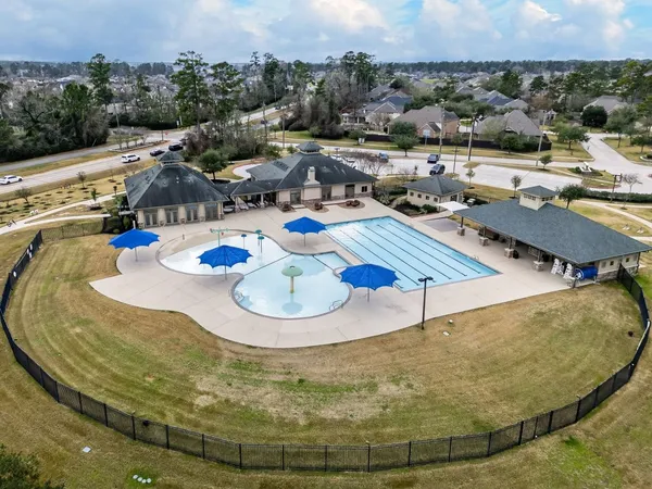 a view of a swimming pool with chairs