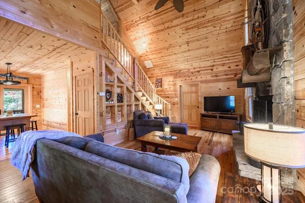 a view of entryway livingroom and hall with wooden floor
