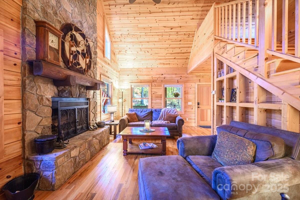 87 Prater Cove Road Franklin, NC 28734 - Photo 21 of 34 a living room with furniture and a fireplace