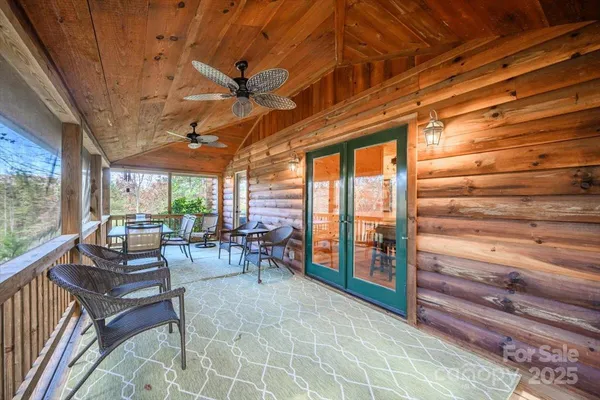 a view of entryway with wooden floor and windows