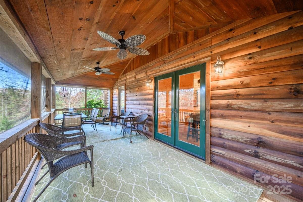 87 Prater Cove Road Franklin, NC 28734 - Photo 28 of 34 a living room with furniture and a large window