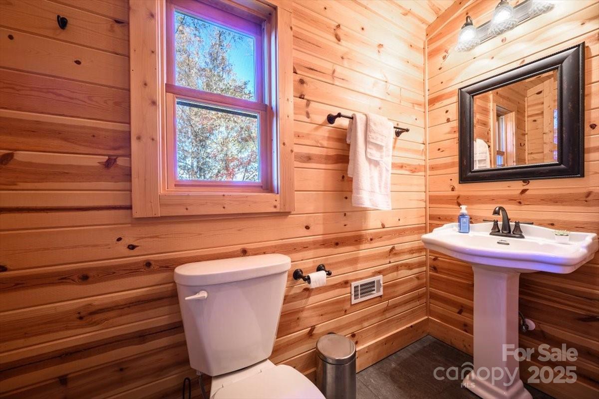 87 Prater Cove Road Franklin, NC 28734 - Photo 32 of 34 a bathroom with a sink and a mirror