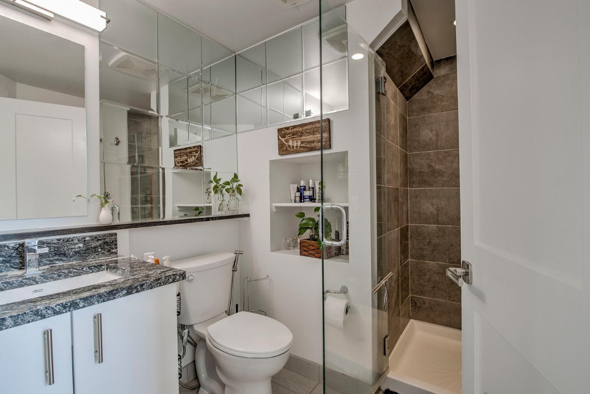 100 Basecamp Way, Unit 217 Frisco, CO 80443 - Photo 13 of 39 a bathroom with a granite countertop sink toilet and shower