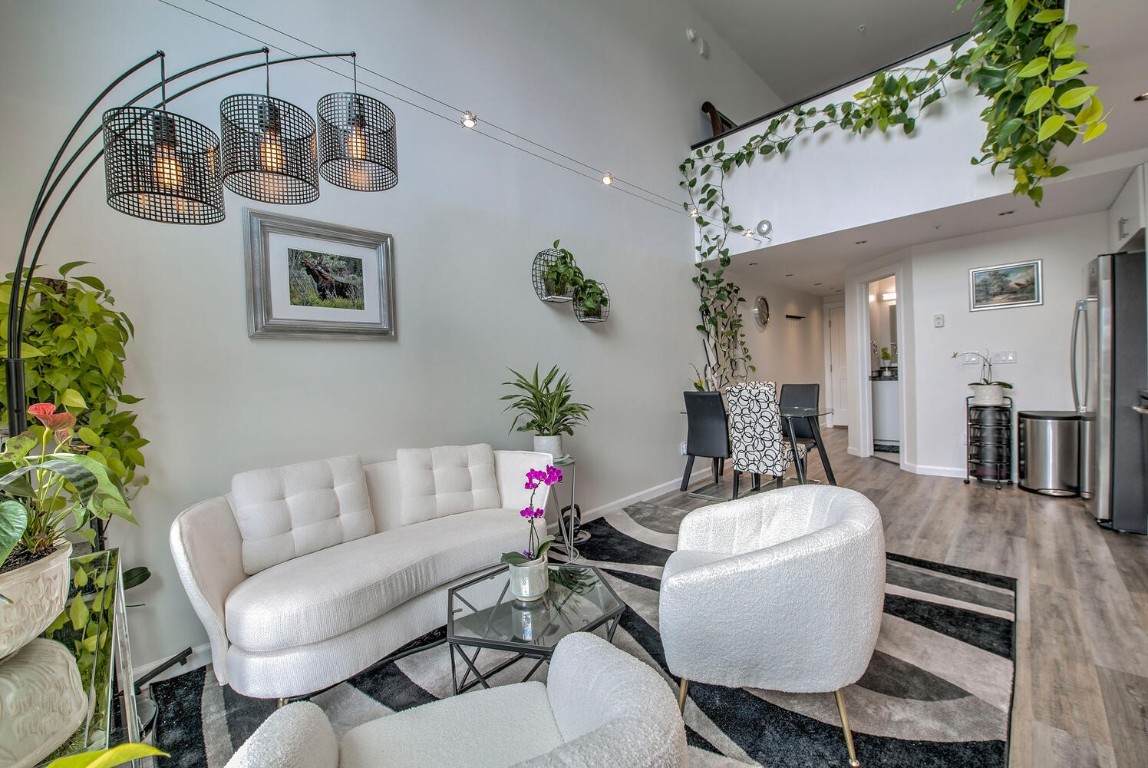 100 Basecamp Way, Unit 217 Frisco, CO 80443 - Photo 2 of 39 a living room with furniture and a chandelier