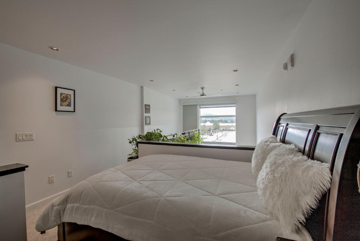 100 Basecamp Way, Unit 217 Frisco, CO 80443 - Photo 24 of 39 a bedroom with a bed and a window