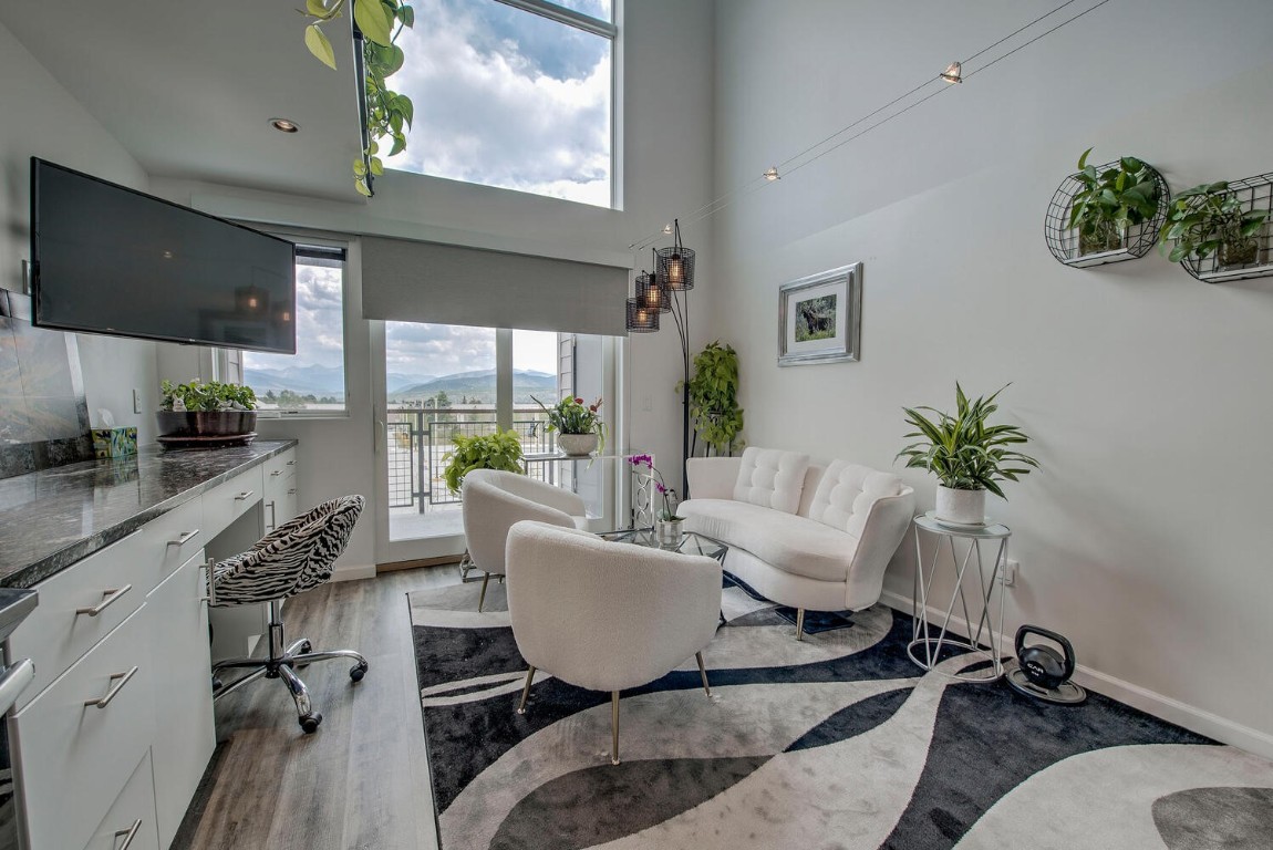 100 Basecamp Way, Unit 217 Frisco, CO 80443 - Photo 5 of 39 a living room with furniture fireplace and a flat screen tv